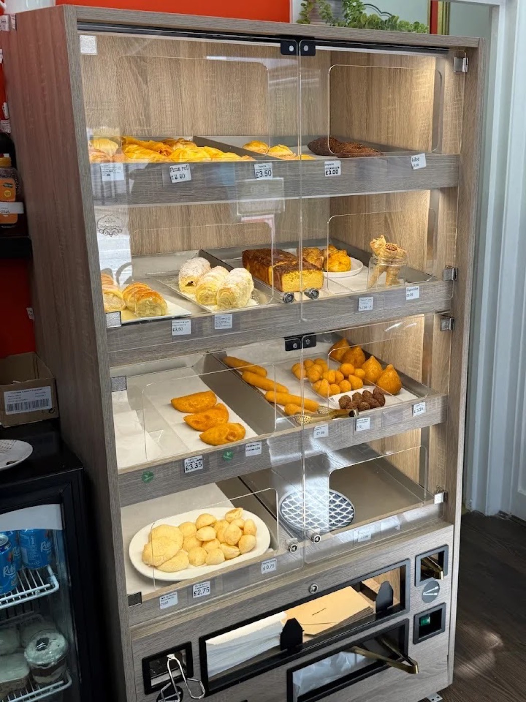The glass counter of Brazilian pastries, cakes and savouries